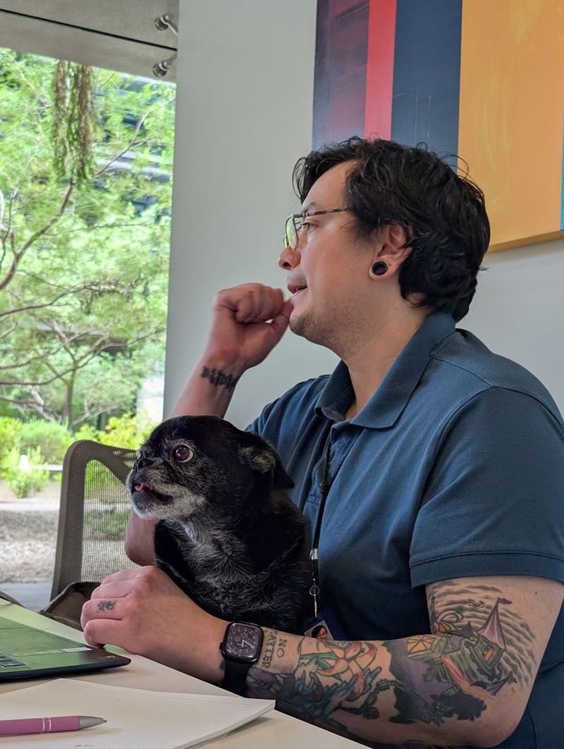 One of our advisors on a sales call at home, with his dog beside him